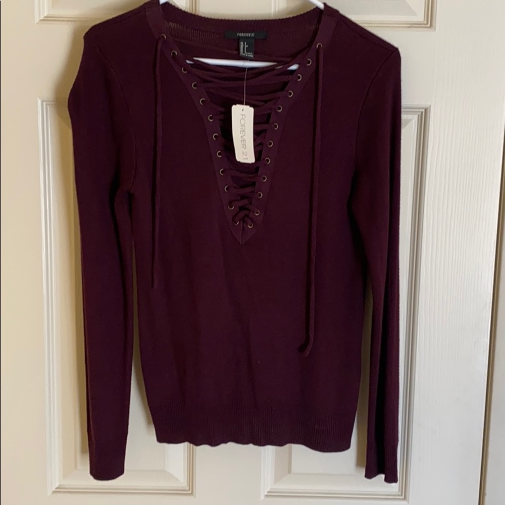 Sweater top with lace up detail
